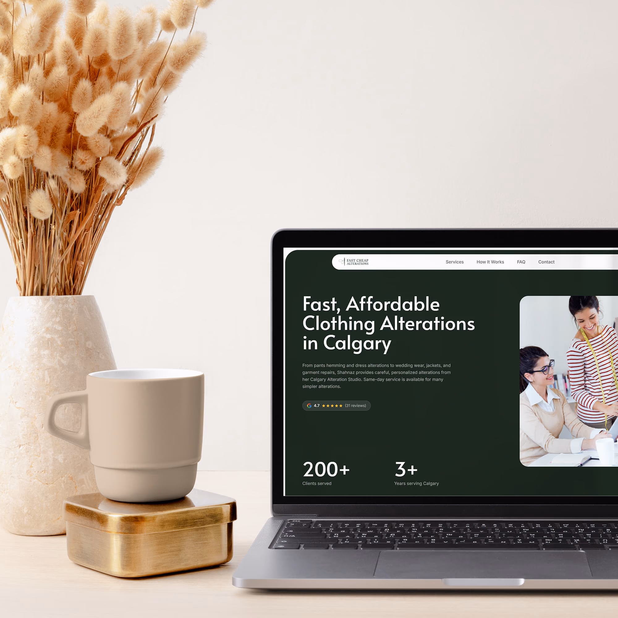 Fast Cheap Alterations homepage shown on a laptop beside a coffee mug and dried flowers