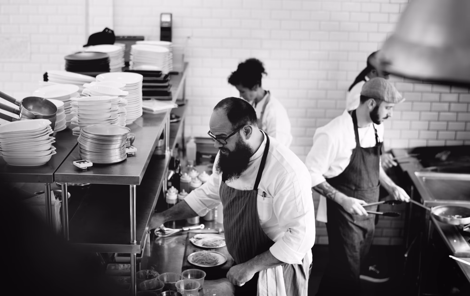 A group of chefs working together in a restaurant kitchen