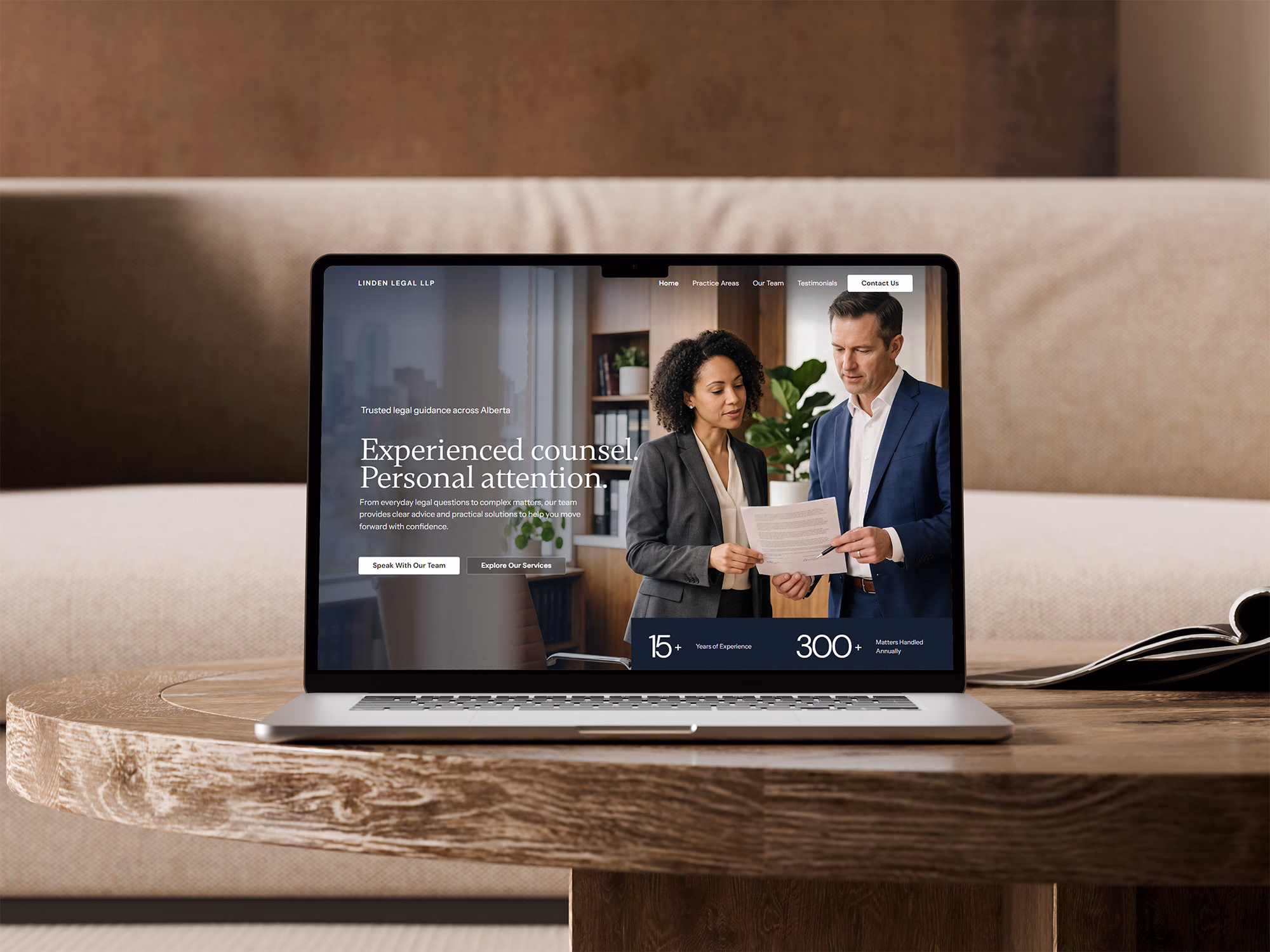Linden Legal LLP homepage hero on a laptop resting on a wooden coffee table, with the headline Experienced counsel. Personal attention.