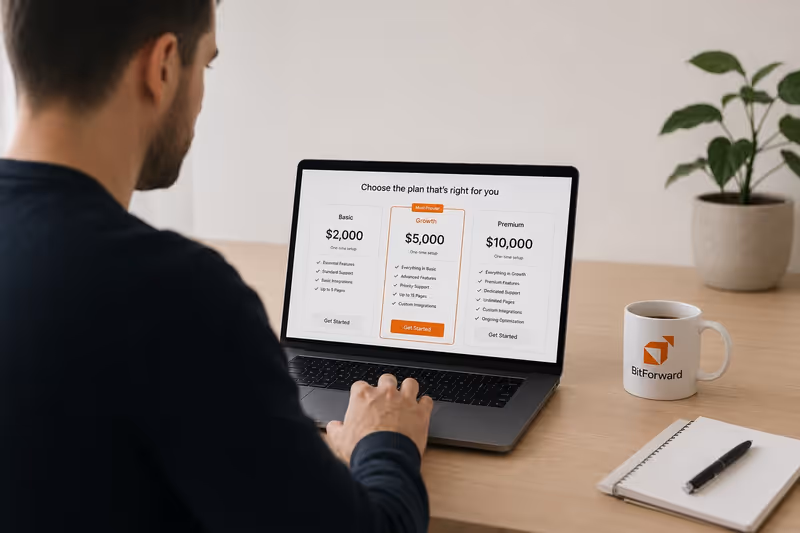 A Canadian service business owner reviewing website pricing options on a laptop